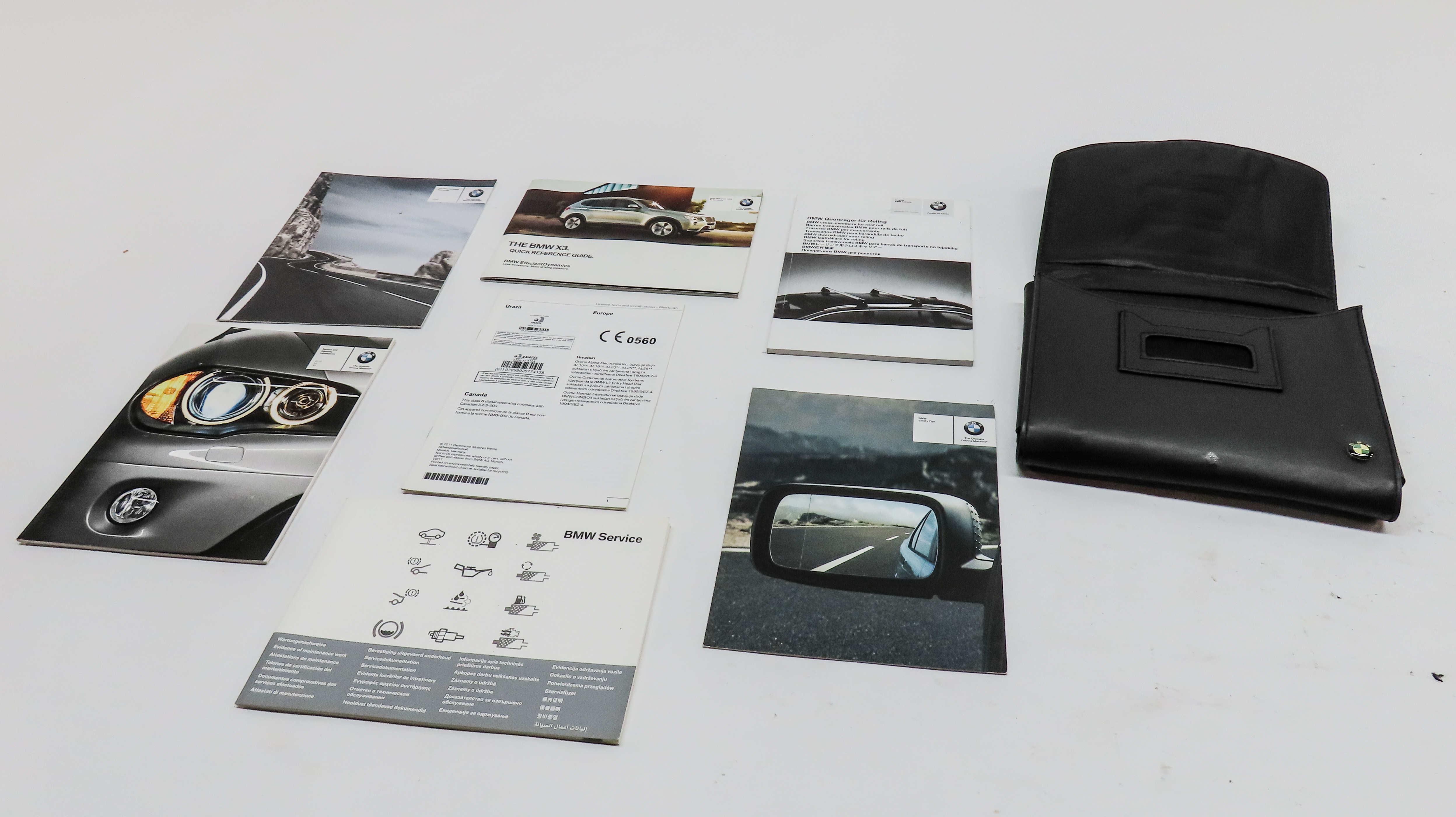 2012 BMW X3 (F25) OWNERS MANUAL BOOKLET SET 7 w/ CARRYING CASE — exact item pictured